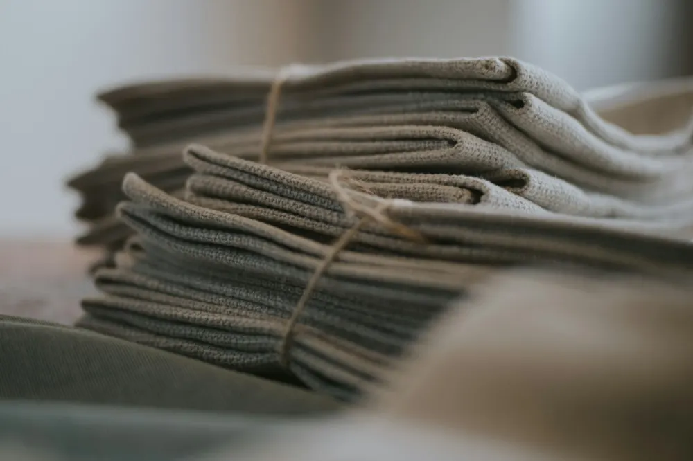 Reusable cleaning cloths tied with twine