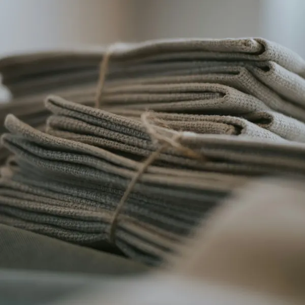 Reusable cleaning cloths tied with twine